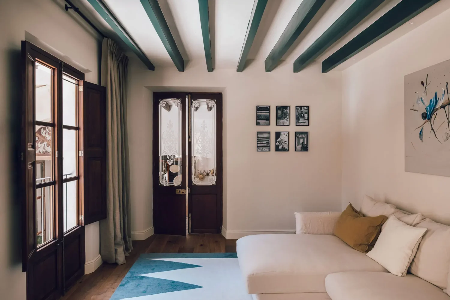 Beautiful Period Features in an Early 20th-Century Majorcan Townhouse 2 living room with wooden beams