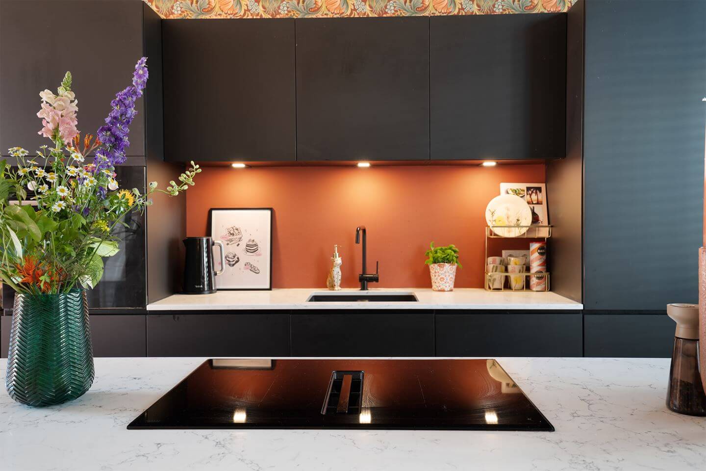 Rich Colors in a Charming Late 19th-Century Home in The Netherlands 9 modern black kitchen with terracotta colored splashback nordroom