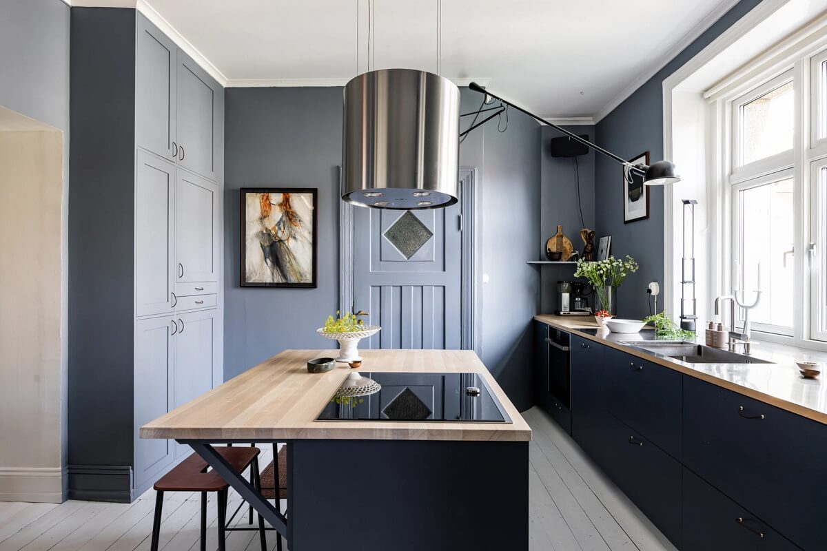 A Swedish Apartment with a Moody Kitchen and Bedroom 8 moody kitchen with island and bar seating A Swedish Apartment with a Moody Kitchen and Bedroom