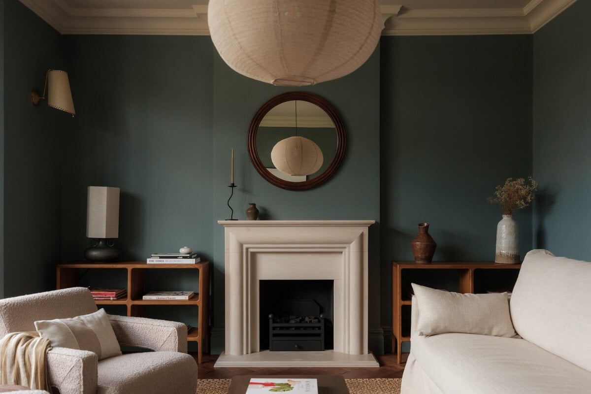 A Calm Color Palette and Warm Materials in a London Home 1 moody living room with fireplace and light furnishings