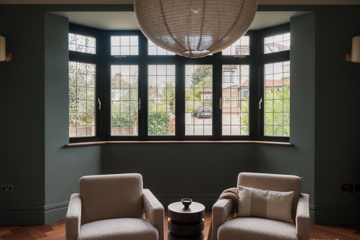A Calm Color Palette and Warm Materials in a London Home 2 moody room with bay window