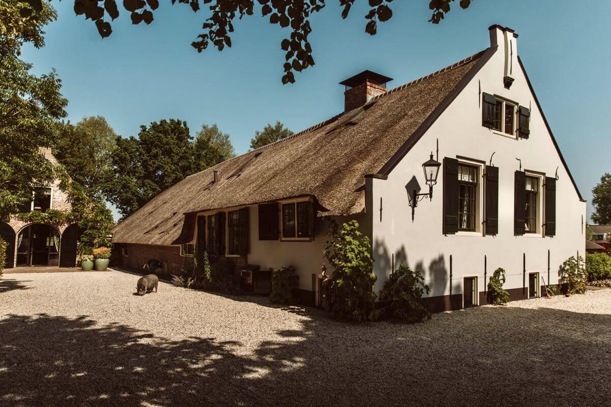 An Eclectic Colorful House in an Old Dutch Farmhouse 1 old white farmhouse