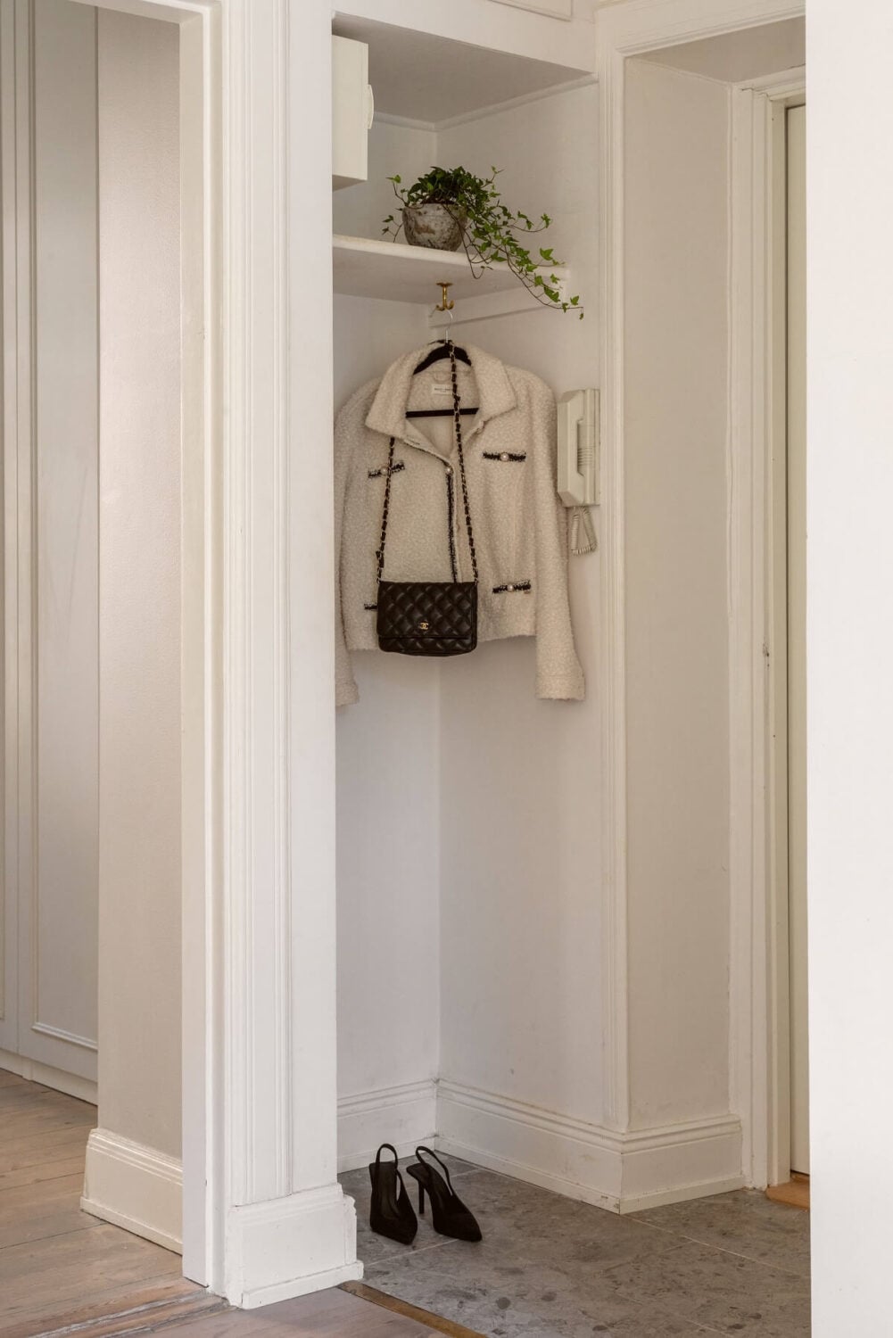 A Tiny Minimalistic Apartment in Stockholm 13 open coat storage hallway