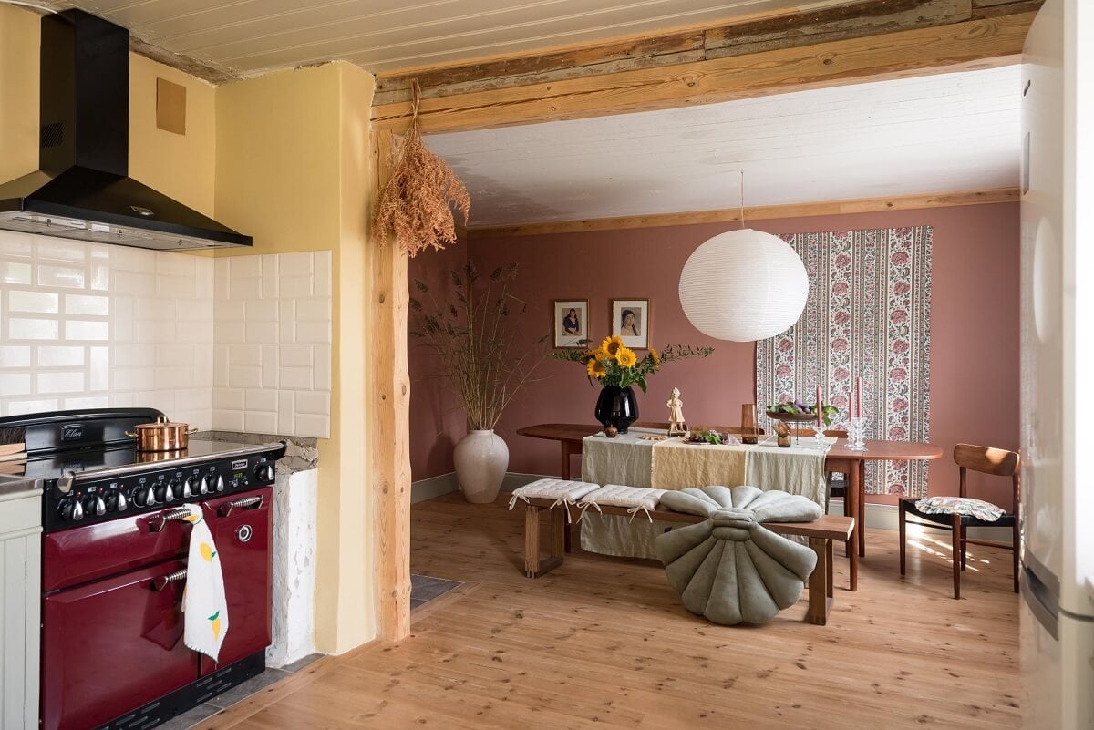A Charming Country House with a Pink Dining Room and Wallpapers 9 open plan kitchen and pink dining room