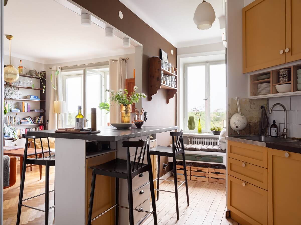 A Small Apartment with an Ochre Yellow Kitchen 11 open plan kitchen ochre yellow cabinets