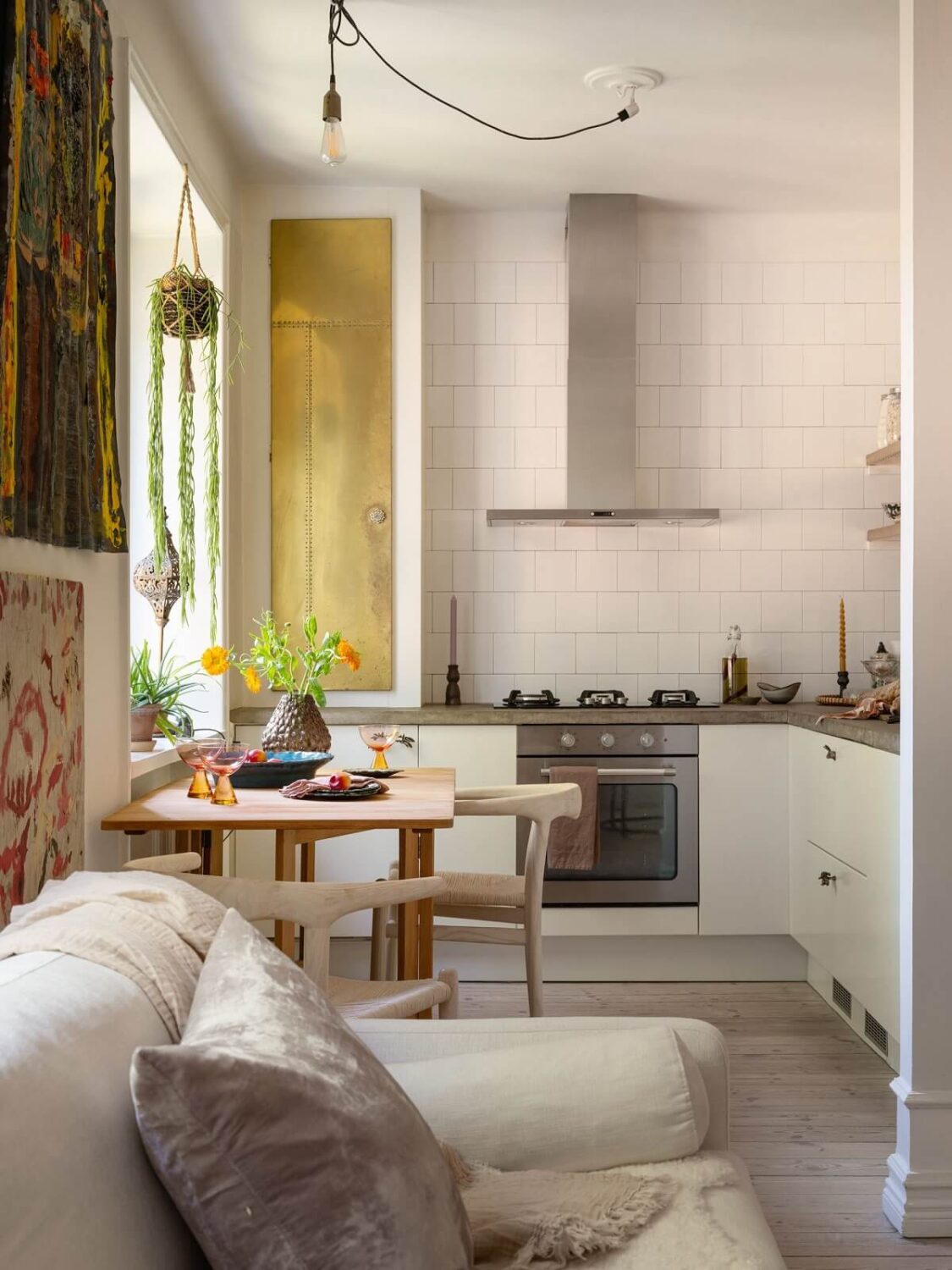 A Light and Well-Planned Apartment in Stockholm 9 open plan kitchen white cabinets