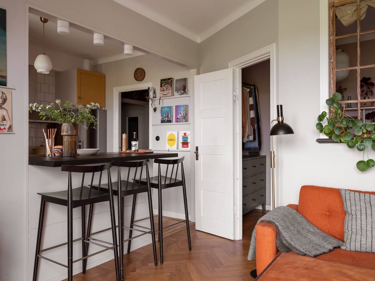 A Small Apartment with an Ochre Yellow Kitchen 10 open plan living room and kitchen with bar seating
