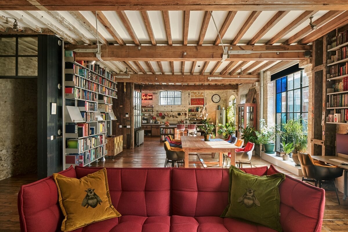 An Industrial and Colorful Warehouse Conversion in London 8 open plan warehouse apartment living space wooden beams