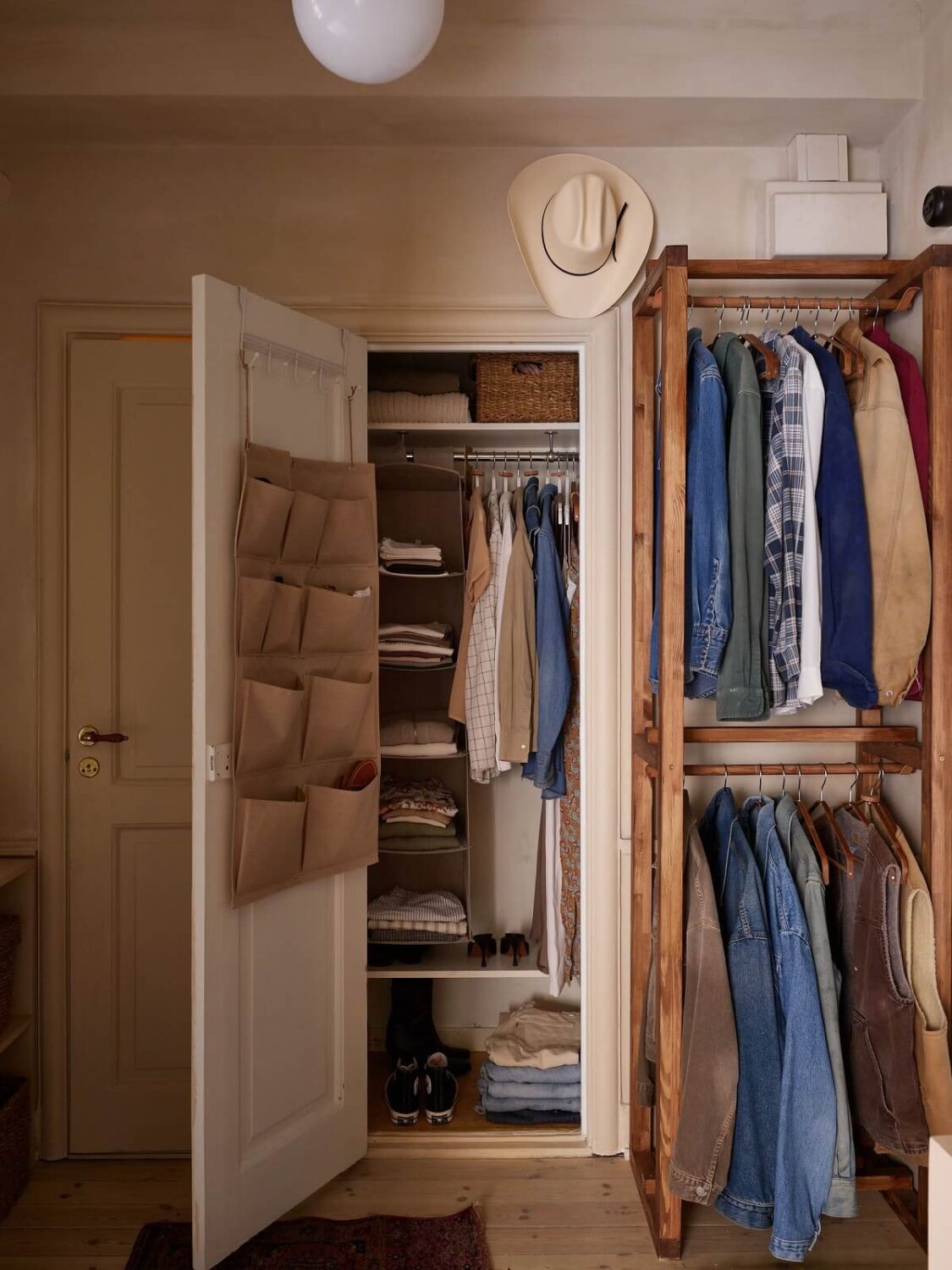 A Studio Apartment with Plaster Walls and a Walnut Kitchen 19 open wardrobe and built in cabinet A Studio Apartment with Plaster Walls and a Walnut Kitchen