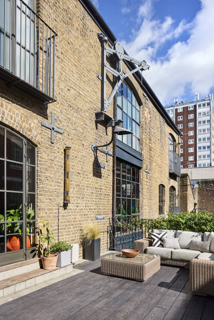 An Industrial and Colorful Warehouse Conversion in London 22 outdoor seating former warehouse