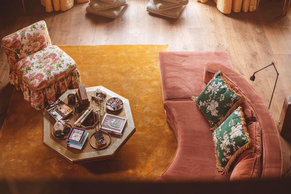 An Eclectic Colorful House in an Old Dutch Farmhouse 19 pink sofa ochre yellow rug