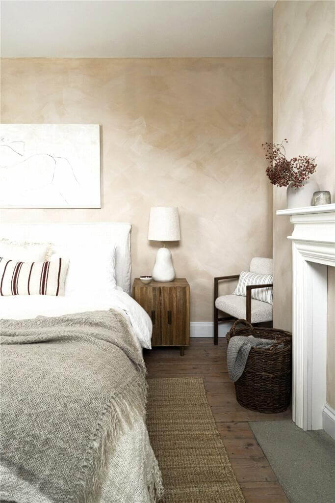 A Stylish Two Bedroom Maisonette in London 10 plaster pink bedroom with fireplace and wooden floor