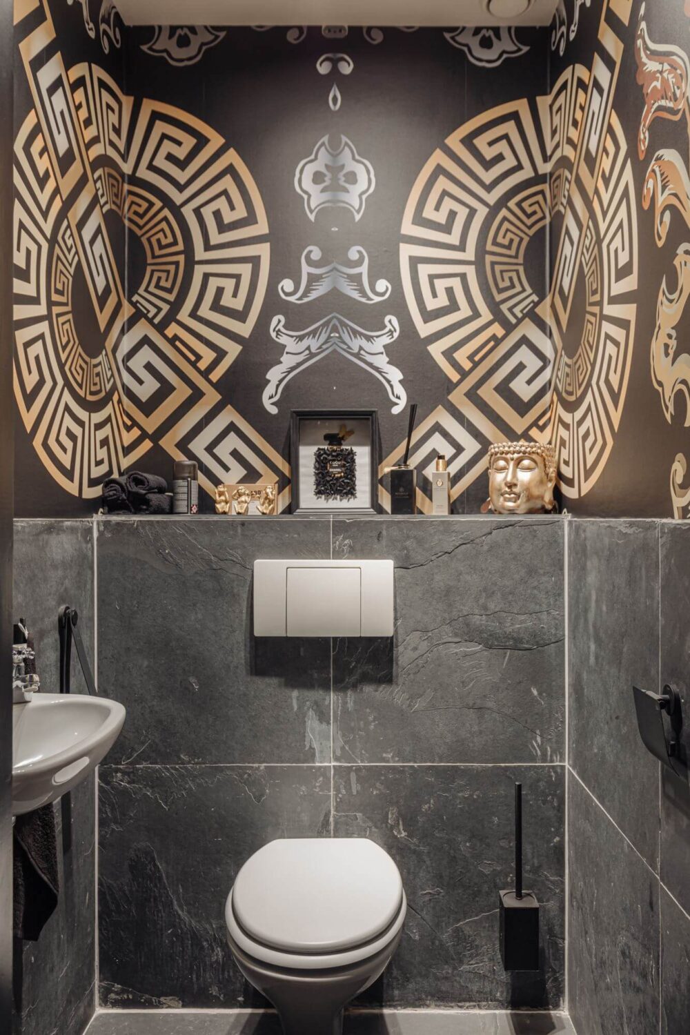 A Charming Apartment in a Historic Canal House 12 powder room with wallpaper