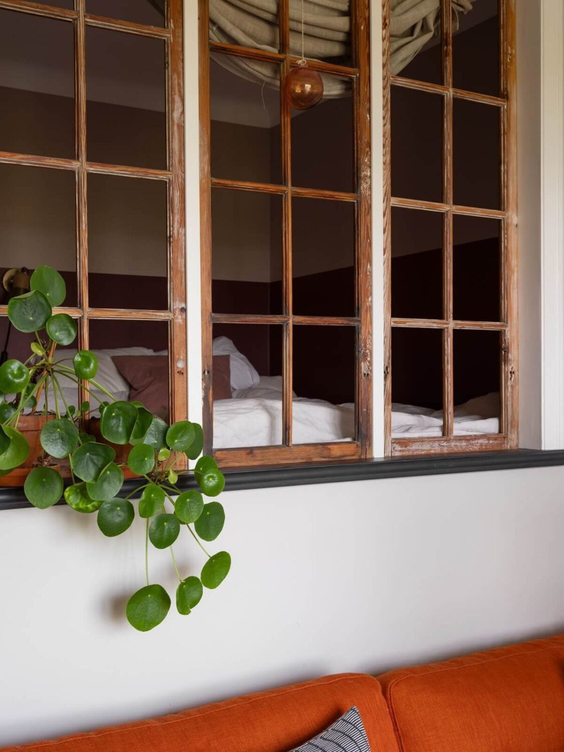 A Small Apartment with an Ochre Yellow Kitchen 17 reclaimed window