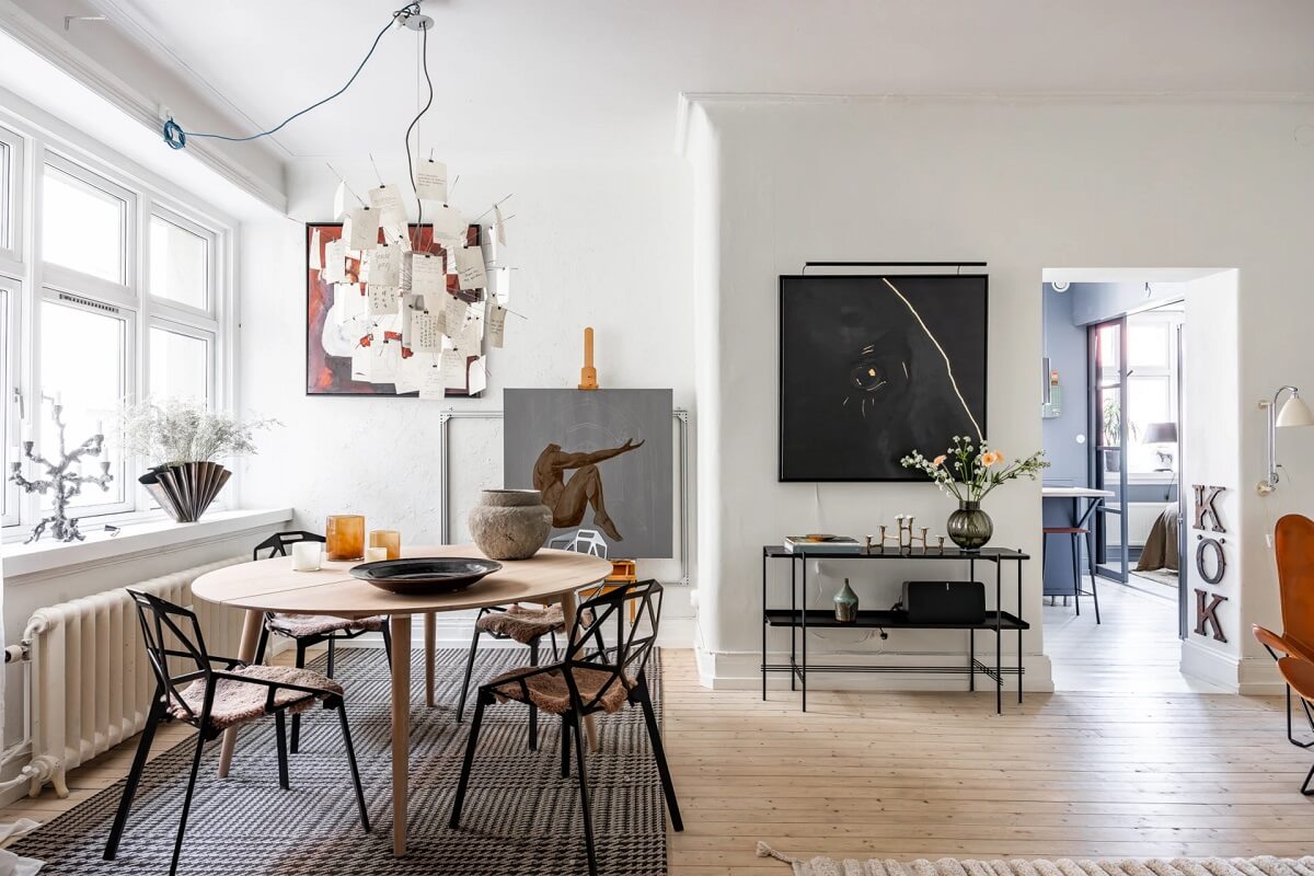 A Swedish Apartment with a Moody Kitchen and Bedroom 4 round dining table