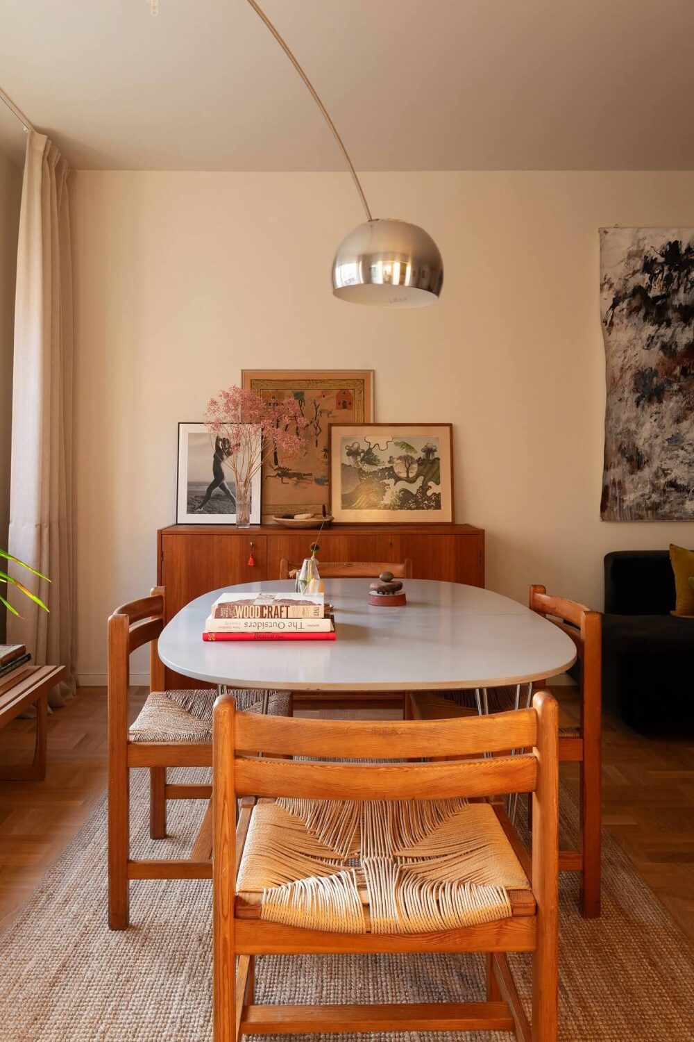 A Stylish Small Loft with Beautiful Natural Light 7 rounded dining table with design chairs