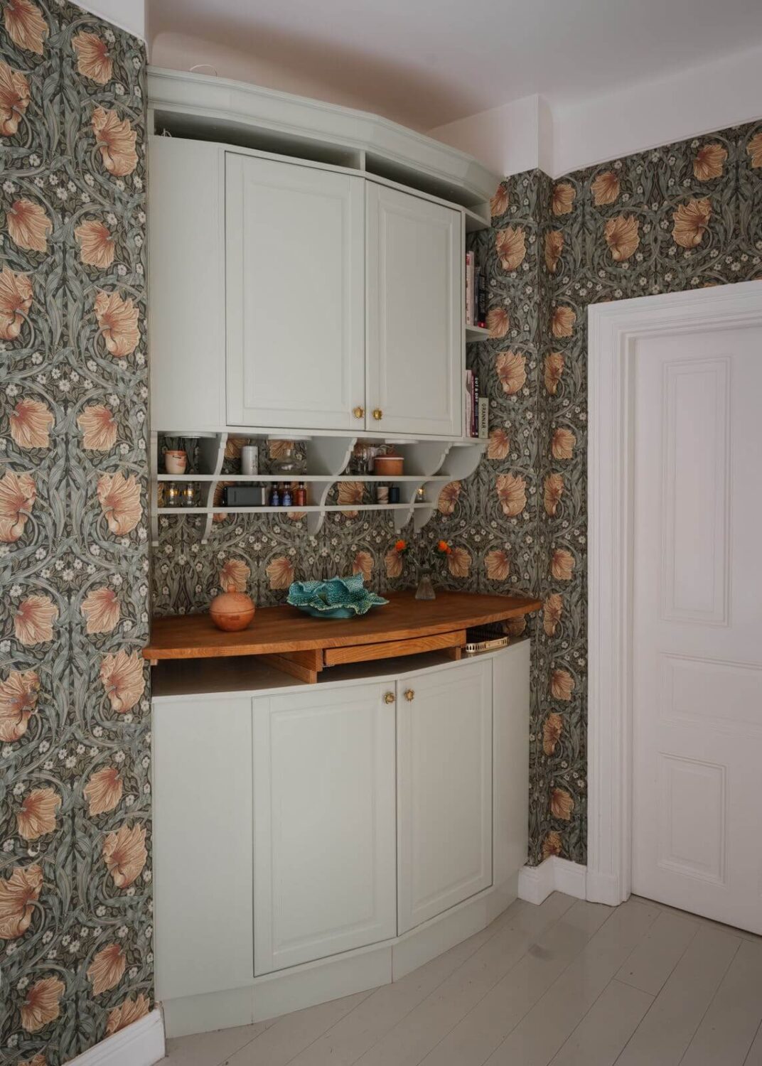 An Apartment with William Morris Wallpaper and a Dull Plum Bedroom 5 rounded light green cabinets and pimpernel wallpaper nordroom