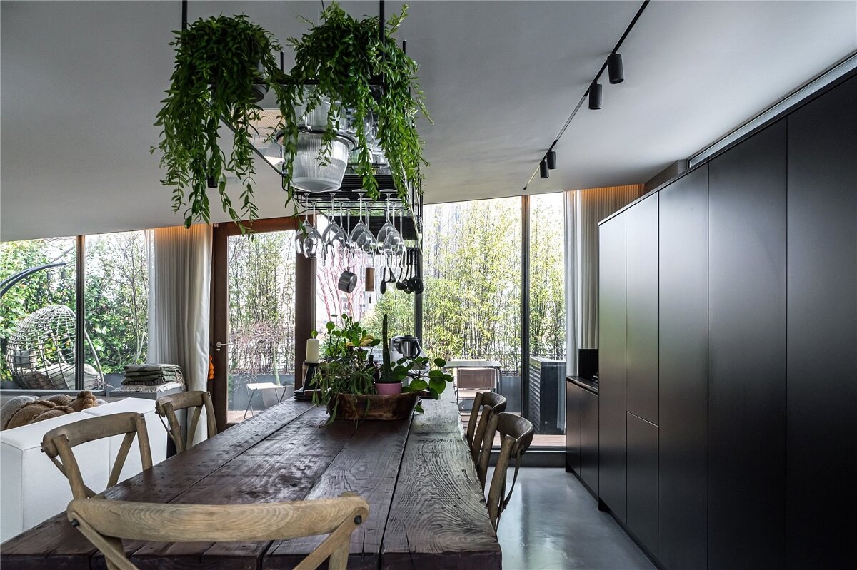 An Industrial, Loft-Style Duplex with Japanese Landscaped Roof Terraces 12 rustic dining table