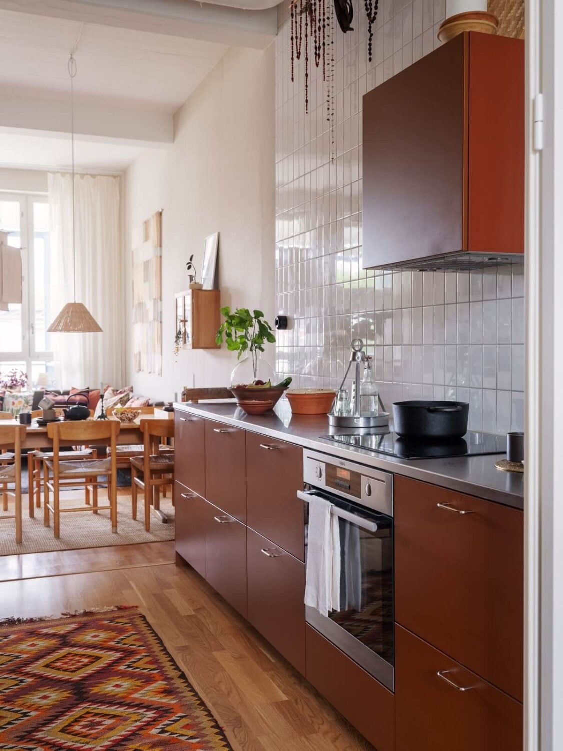 A Scandinavian Family Apartment with a Rusty Red Kitchen 9 rusty red kitchen cabinets
