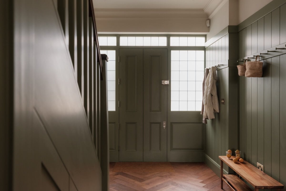 A Calm Color Palette and Warm Materials in a London Home 16 sage green hallway wooden floor