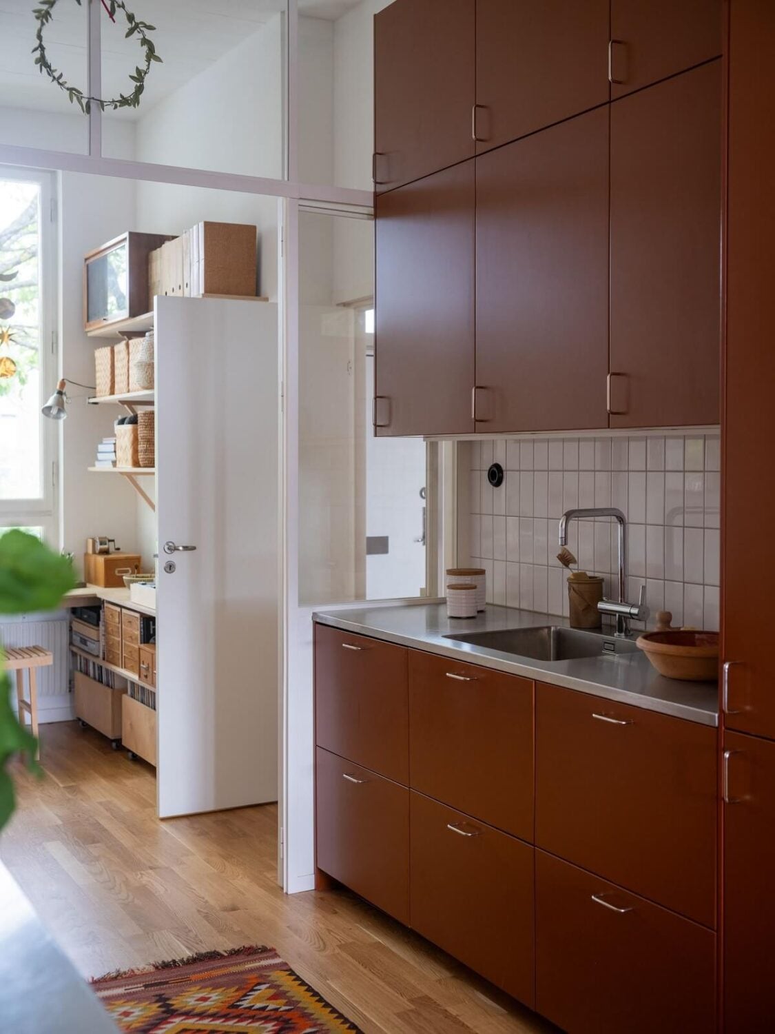 A Scandinavian Family Apartment with a Rusty Red Kitchen 10 scandi apartment rusty red cabinets