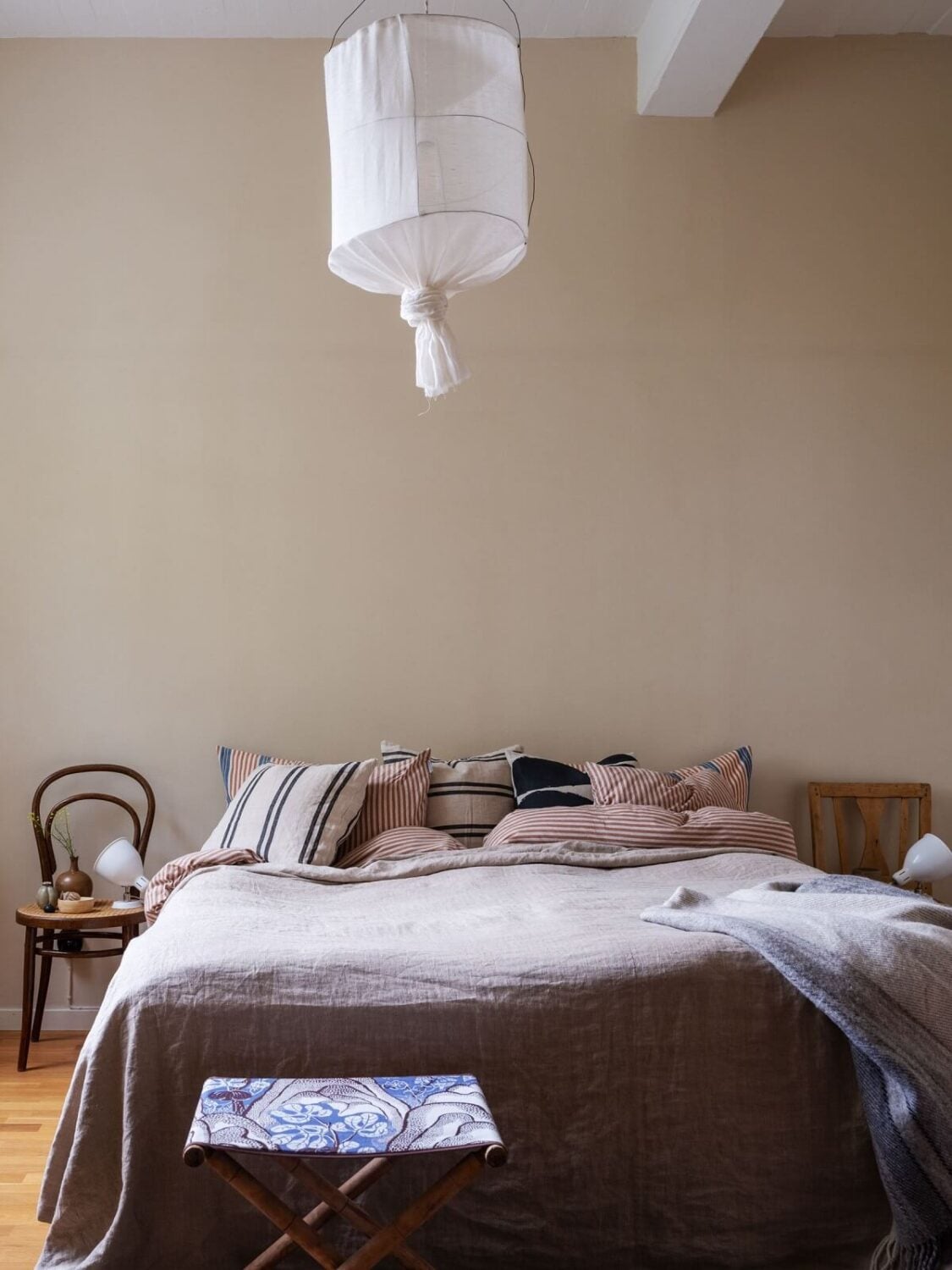 A Scandinavian Family Apartment with a Rusty Red Kitchen 19 serene gray bedroom