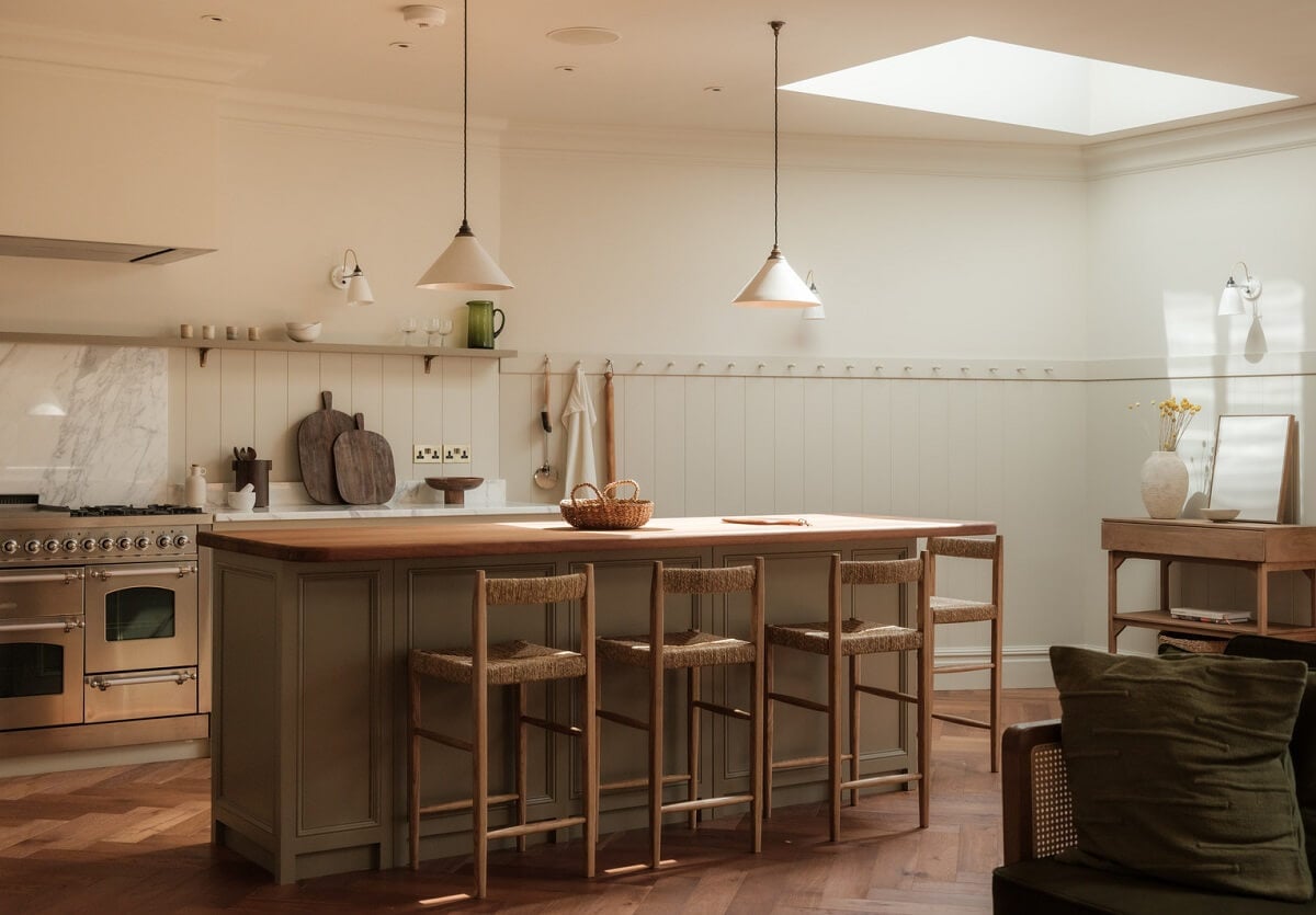 A Calm Color Palette and Warm Materials in a London Home 7 serene kitchen with island and skylight
