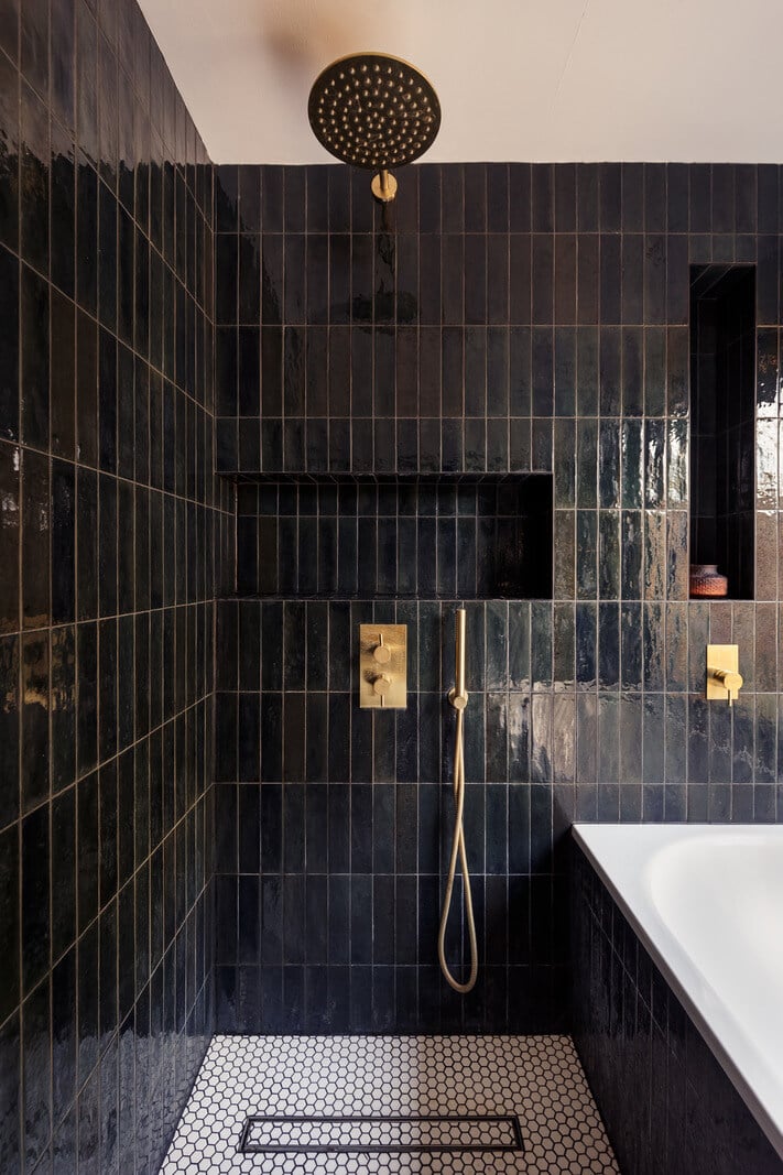 A Warm Ground Floor Apartment with Reclaimed Materials 10 shower with black tiles