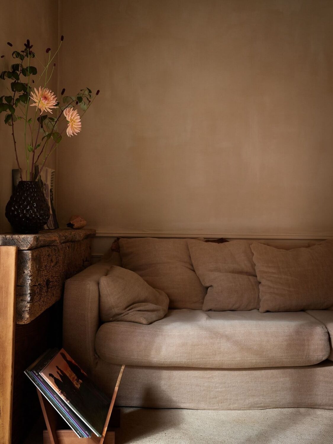A Studio Apartment with Plaster Walls and a Walnut Kitchen 2 sitting area with plaster walls