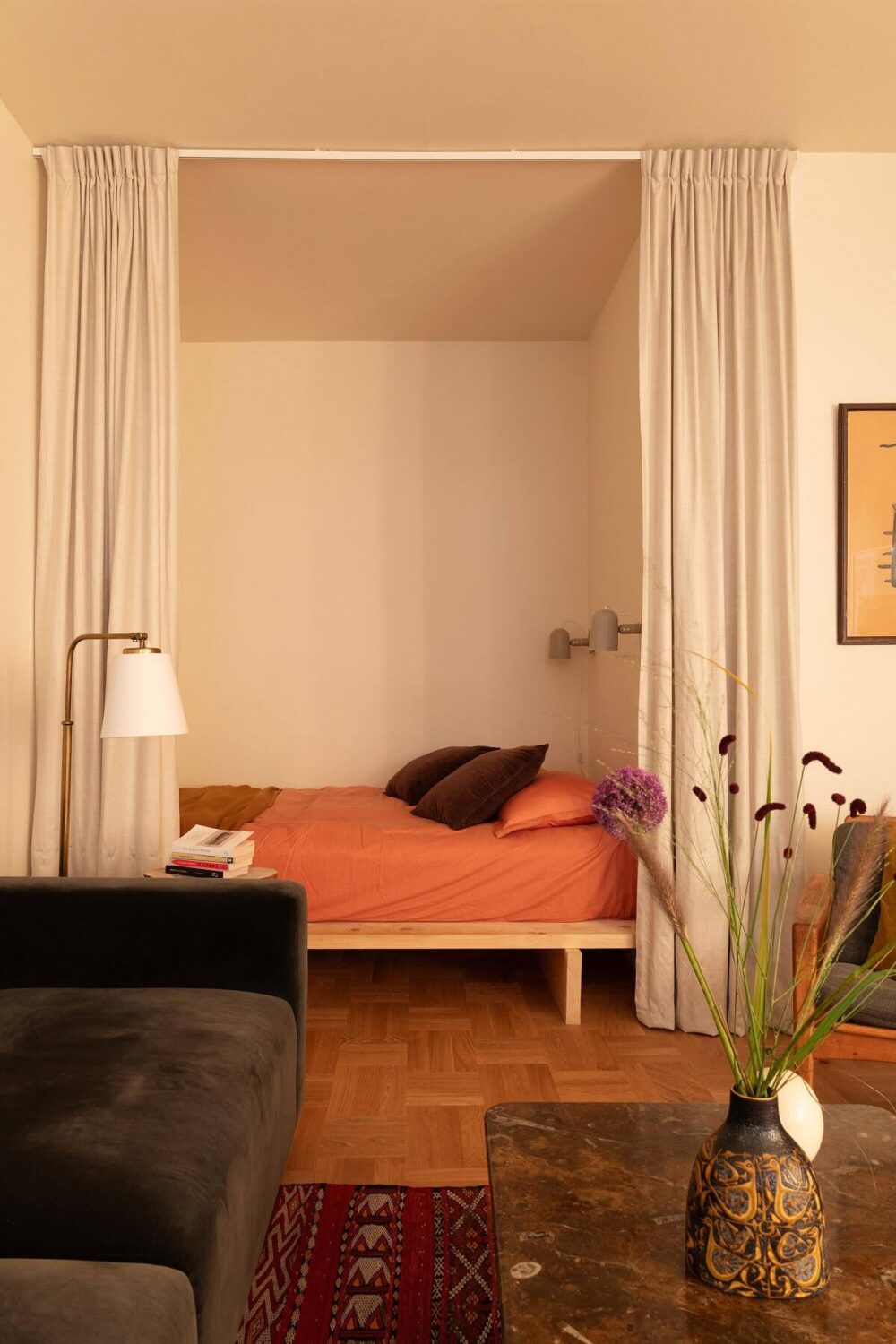 A Stylish Small Loft with Beautiful Natural Light 3 sleeping nook with curtains