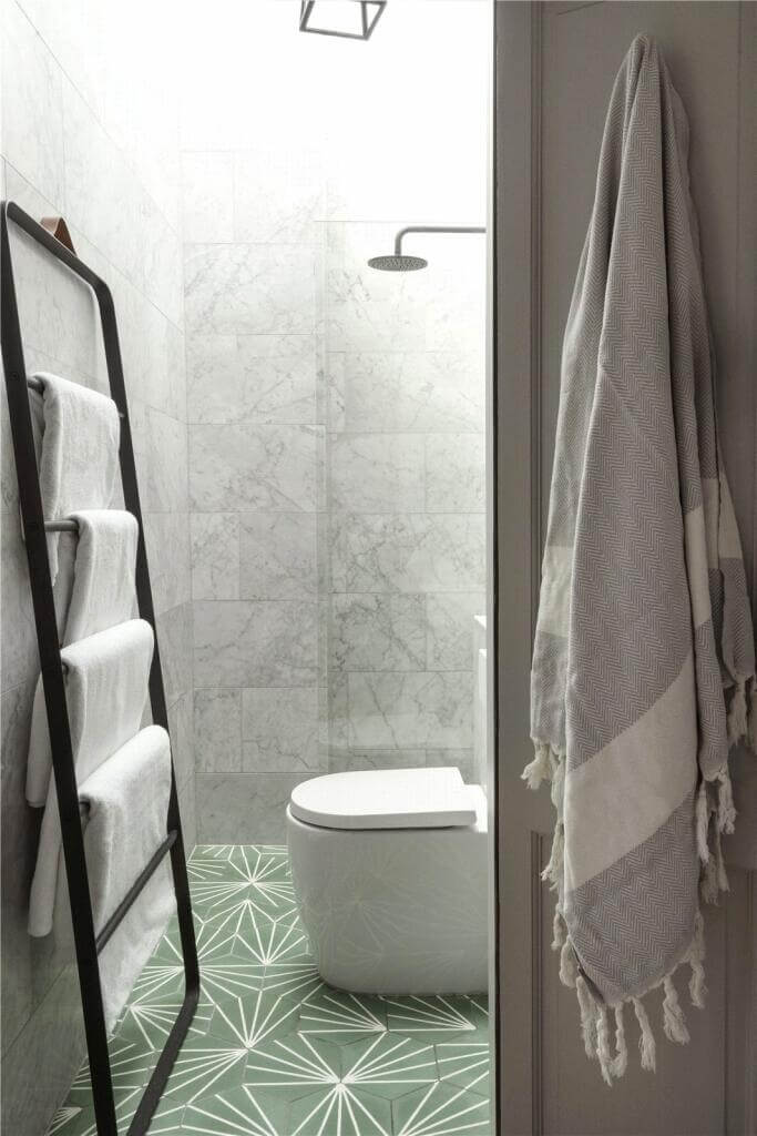 A Stylish Two Bedroom Maisonette in London 15 small bathroom with green patterned floor tiles
