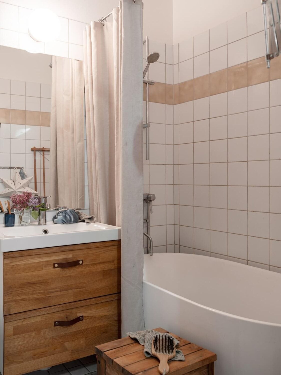 A Small Apartment with an Ochre Yellow Kitchen 19 small bathroom with wooden vanity and bath