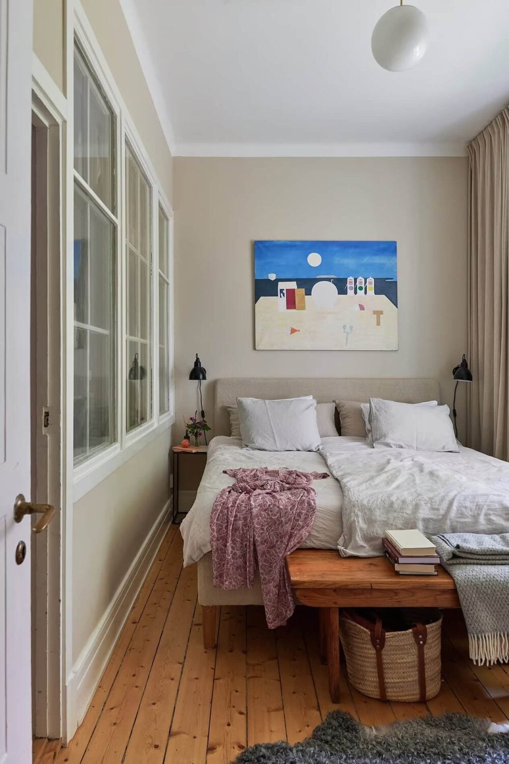Soothing Colors and Smart Solutions in a Two Bedroom Apartment 10 small gray bedroom with wooden floor