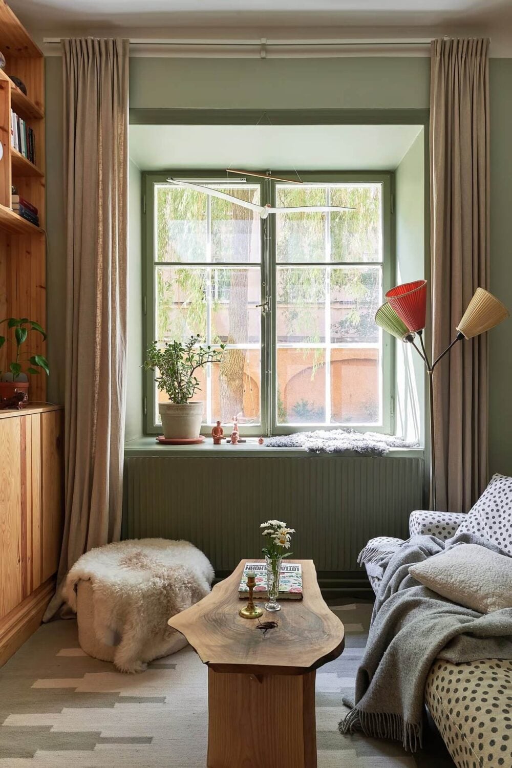 Soothing Colors and Smart Solutions in a Two Bedroom Apartment 8 small green living room