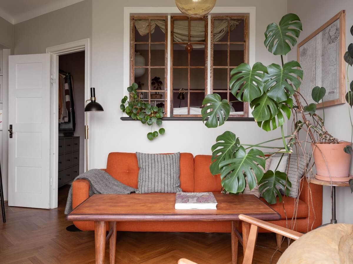 A Small Apartment with an Ochre Yellow Kitchen 3 small living room with burnt orange sofa