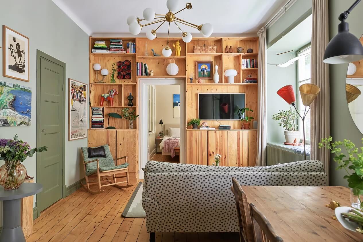 Soothing Colors and Smart Solutions in a Two Bedroom Apartment 7 small living room with wooden feature storage wall nordroom
