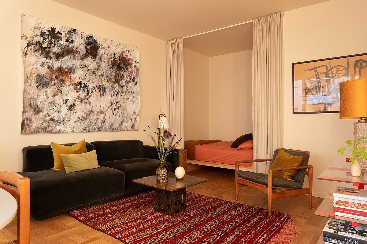 A Stylish Small Loft with Beautiful Natural Light 2 small loft green velvet sofa sleepink nook