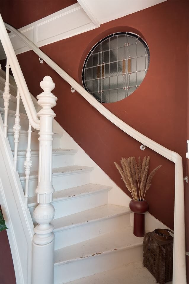 Rich Colors in a Charming Late 19th-Century Home in The Netherlands 27 staircase warm red wall Rich Colors in a Charming Late 19th-Century Home in The Netherlands