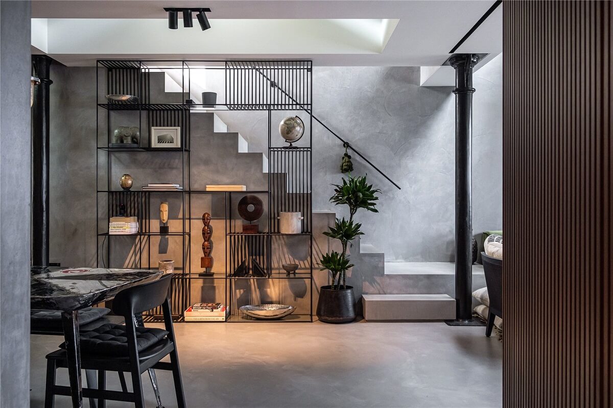 An Industrial, Loft-Style Duplex with Japanese Landscaped Roof Terraces 6 steel bookcase industrial living room