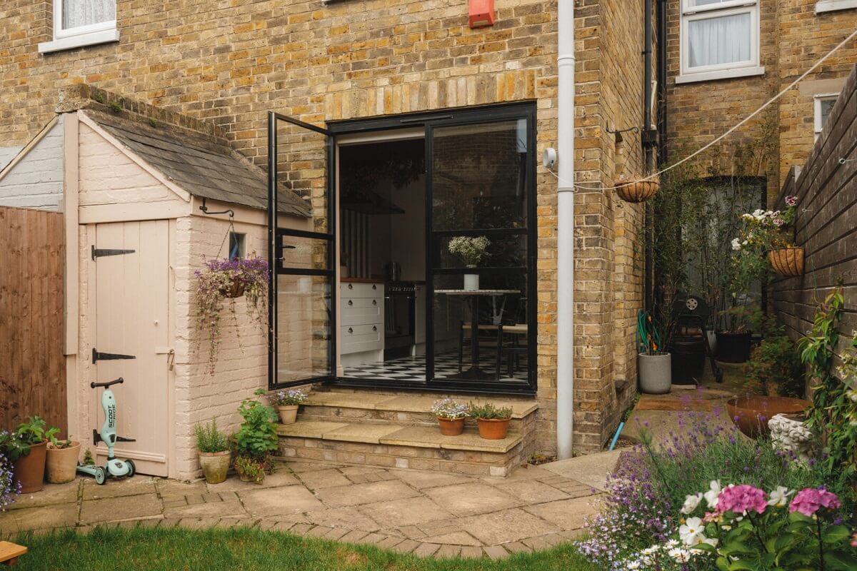 A Charming Victorian House with a Lovely Kitchen 23 steel framed doors pink shed