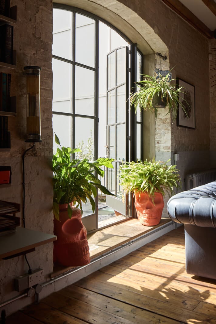 An Industrial and Colorful Warehouse Conversion in London 6 steel framed doors wooden floor warehouse apartment