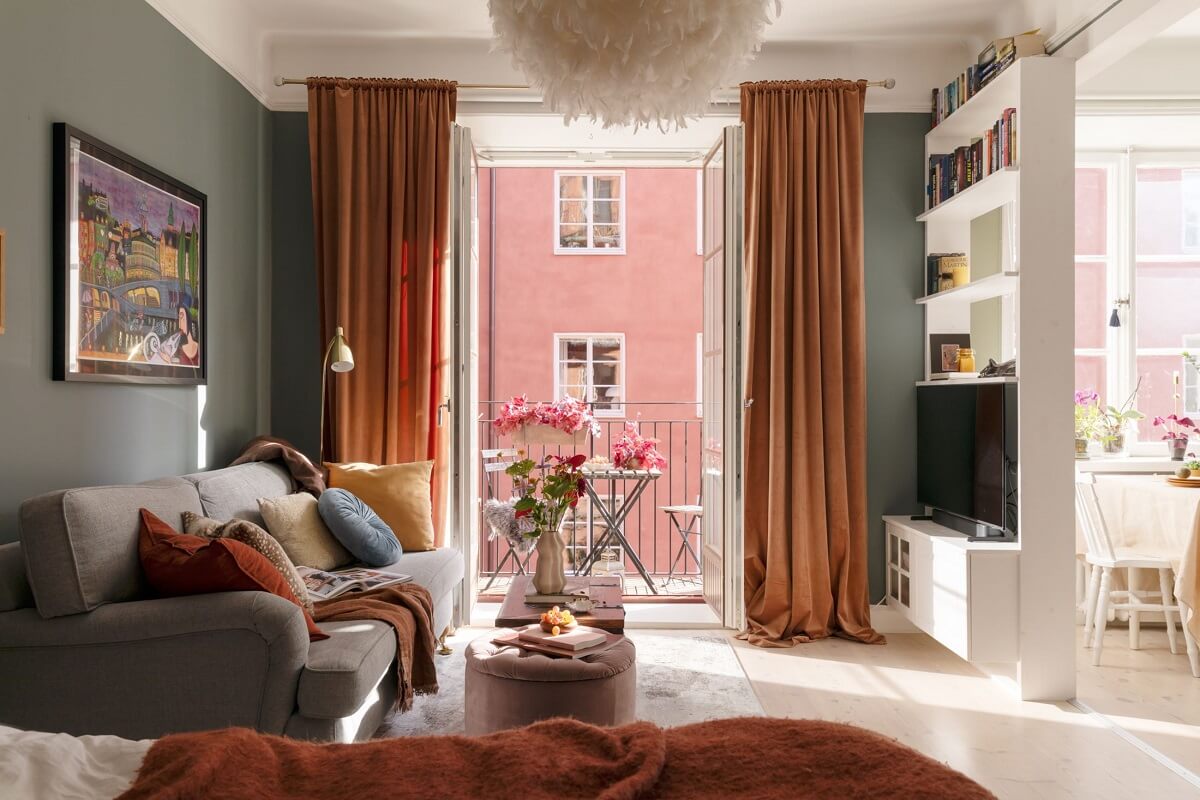 A Stockholm Studio Apartment with Warm Earthy Textiles 8 studio apartment terracotta curtains