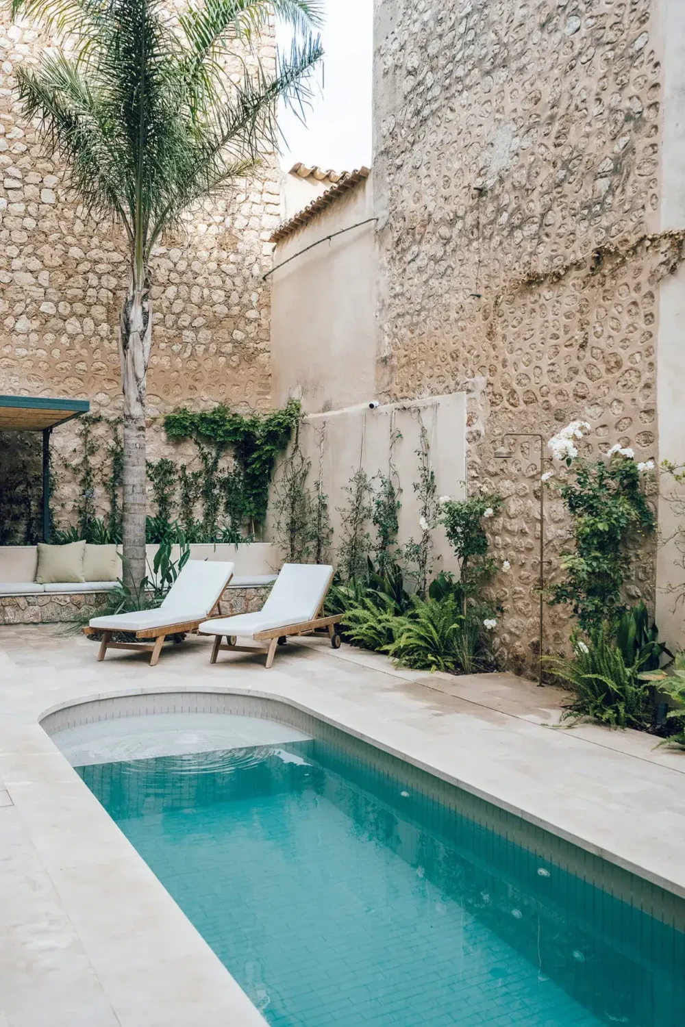 Beautiful Period Features in an Early 20th-Century Majorcan Townhouse 16 swimming pool with lounge beds Beautiful Period Features in an Early 20th-Century Majorcan Townhouse