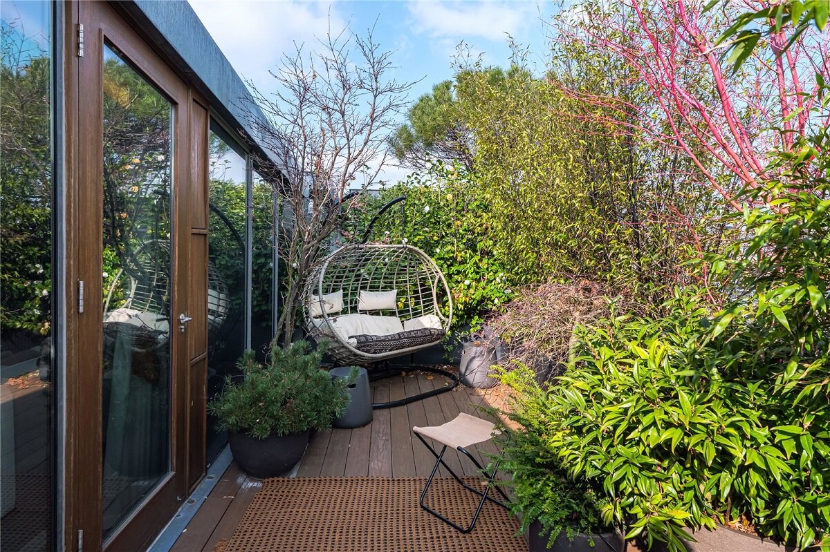 An Industrial, Loft-Style Duplex with Japanese Landscaped Roof Terraces 21 terrace with hanging chair