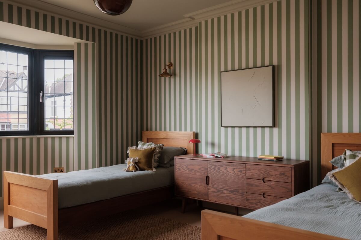 A Calm Color Palette and Warm Materials in a London Home 20 twin bedroom with striped wallpaper