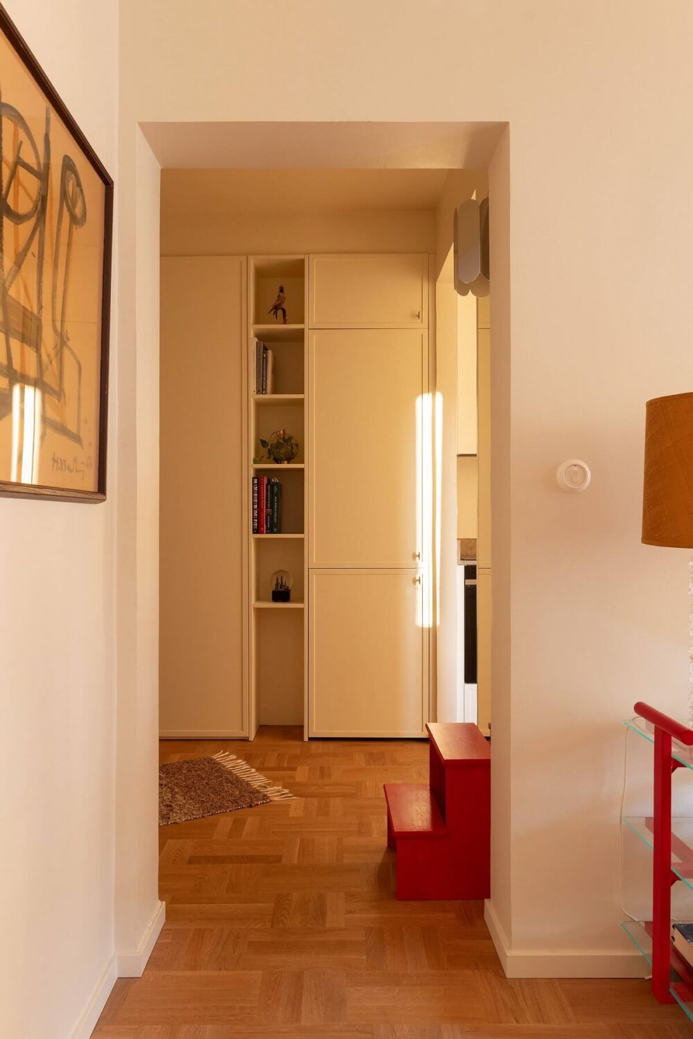 A Stylish Small Loft with Beautiful Natural Light 15 view into hallway built in cabinets