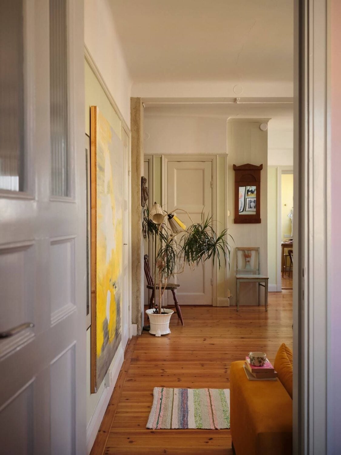 A Charming Small Two-Bedroom Apartment in Stockholm 4 view into living room wooden floor