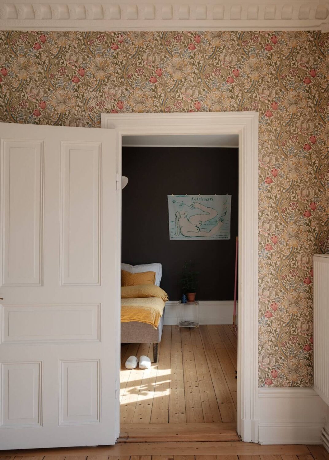 An Apartment with William Morris Wallpaper and a Dull Plum Bedroom 15 view into moody bedroom