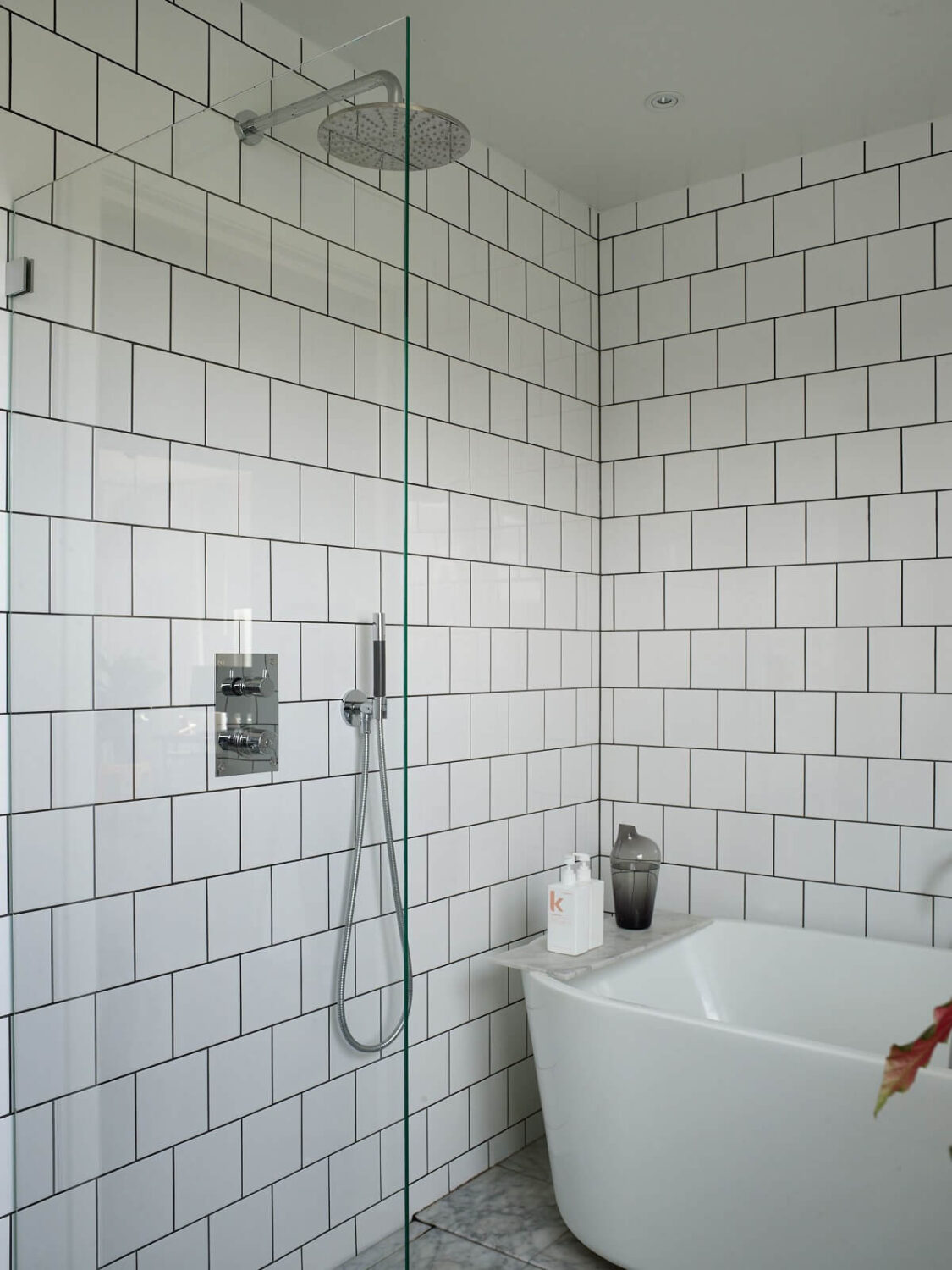 A 1940s House with Painted Floorboards in Sweden 21 white bathroom with shower and bath