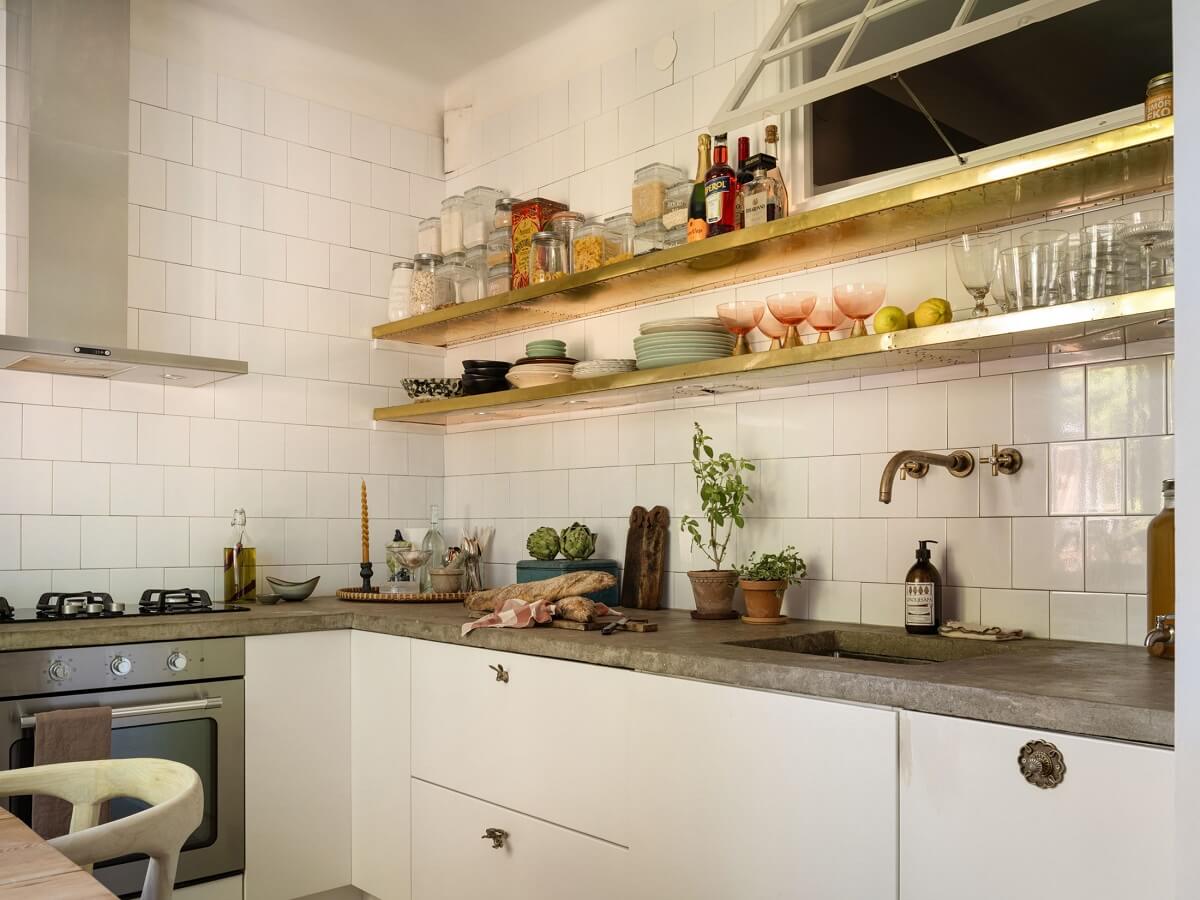 A Light and Well-Planned Apartment in Stockholm 11 white kitchen concrete worktops shelves